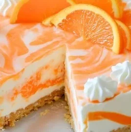 No-bake orange creamsicle cheesecake with vibrant orange topping