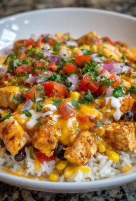 One-Pot Cheesy Southwest Chicken served with rice and toppings