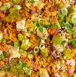 One Pot Veggie Rice dish with colorful vegetables and rice in a bowl