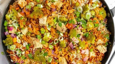 One Pot Veggie Rice dish with colorful vegetables and rice in a bowl