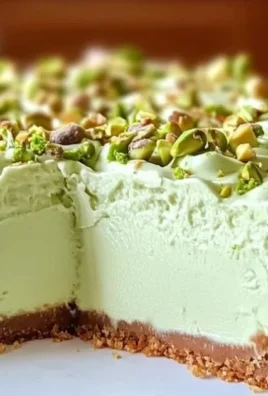 Delicious Pistachio Cheesecake made without baking, topped with crushed pistachios