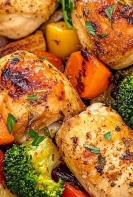 Roasted garlic chicken served with colorful vegetables