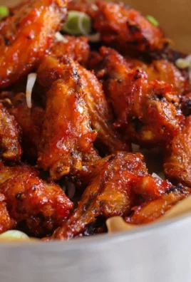 Sticky Asian style chicken wings glazed with soy sauce and sesame seeds