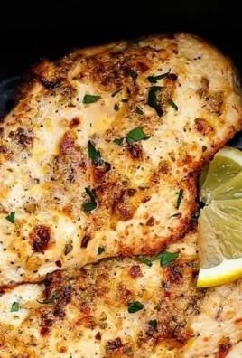 Delicious plate of Air Fryer Garlic Parmesan Chicken garnished with herbs