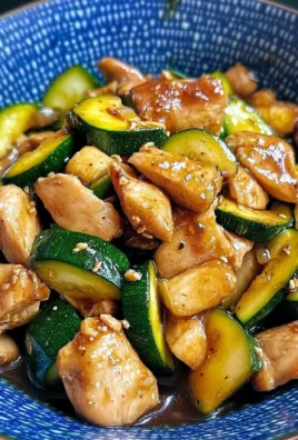 Delicious Chicken Zucchini Stir Fry served in a bowl on a wooden table