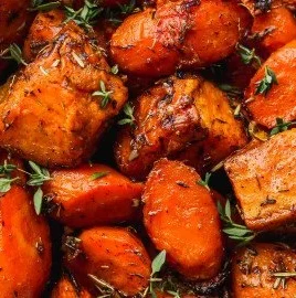 Deliciously roasted sweet potatoes and carrots served on a plate