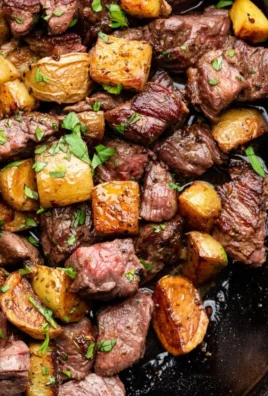 Delicious garlic butter steak bites served with golden potatoes