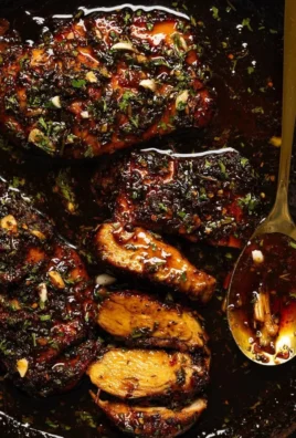 Delicious hot honey baked chicken breasts served with fresh herbs