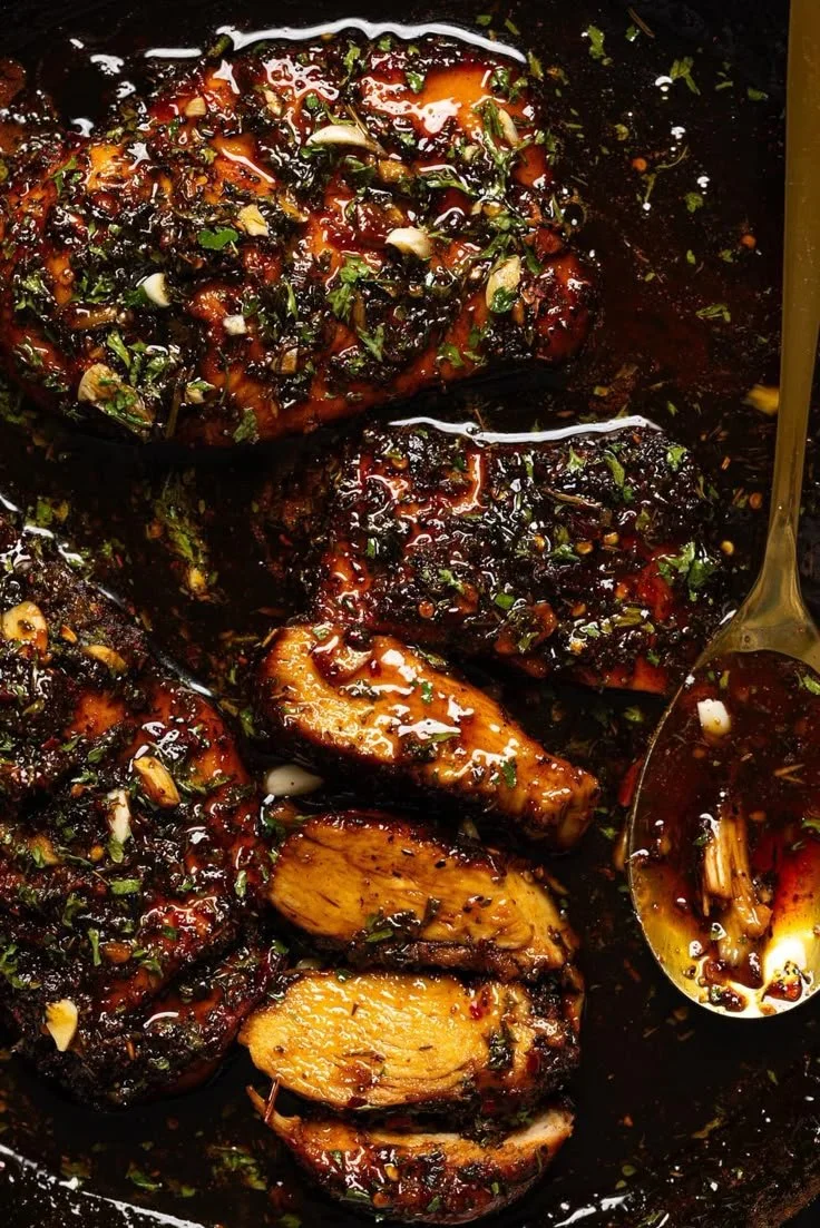 Delicious hot honey baked chicken breasts served with fresh herbs