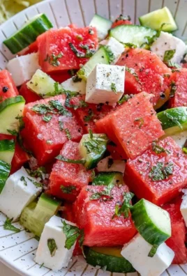 Fresh watermelon cucumber feta salad served in a bowl