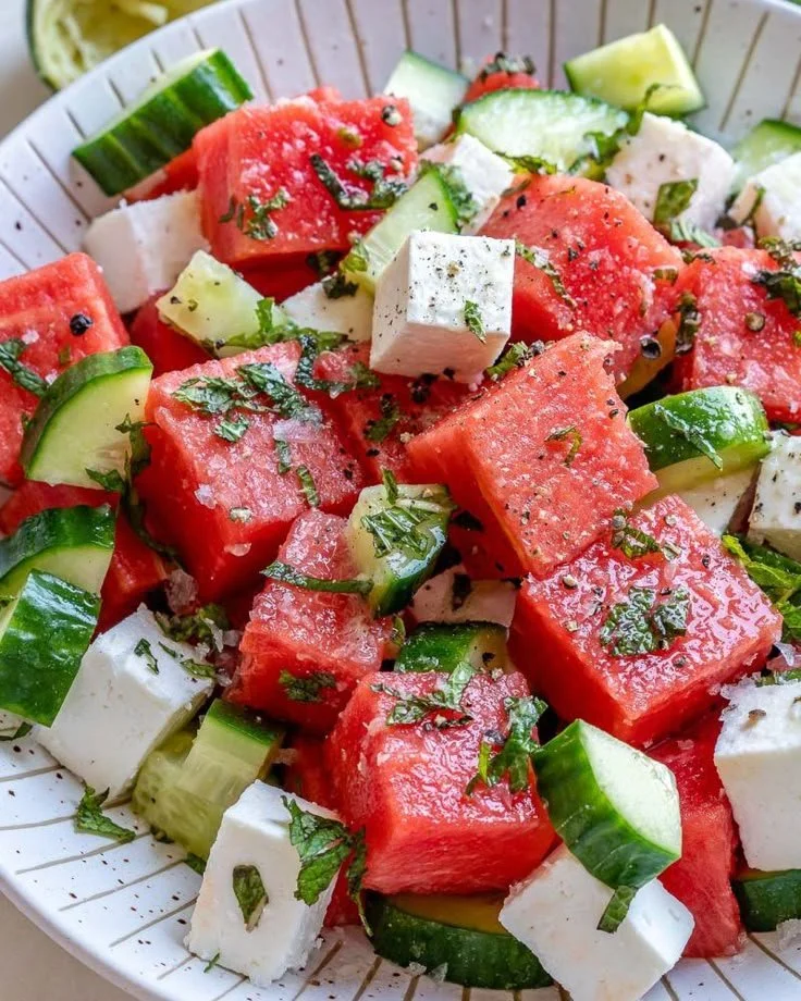 Fresh watermelon cucumber feta salad served in a bowl
