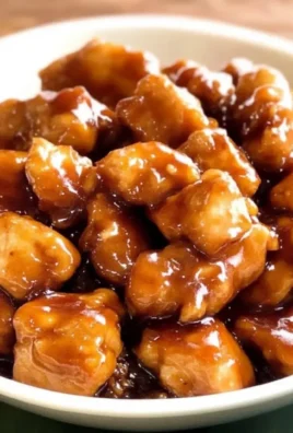 Delicious slow cooker sticky honey chicken dish garnished with herbs