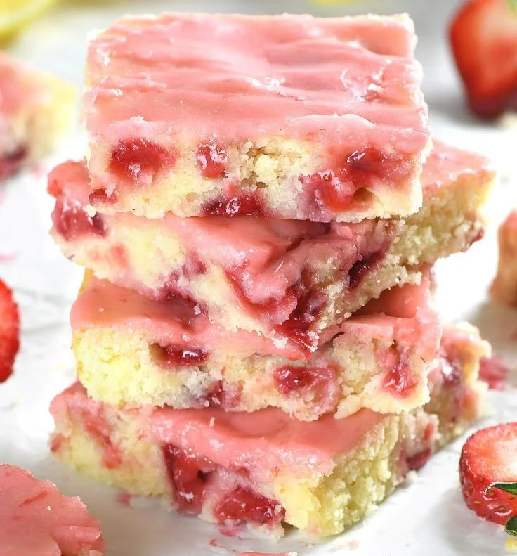 Delicious strawberry lemon blondies topped with fresh strawberries and lemon zest.