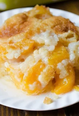 A delicious homemade peach cobbler served warm with a scoop of ice cream.