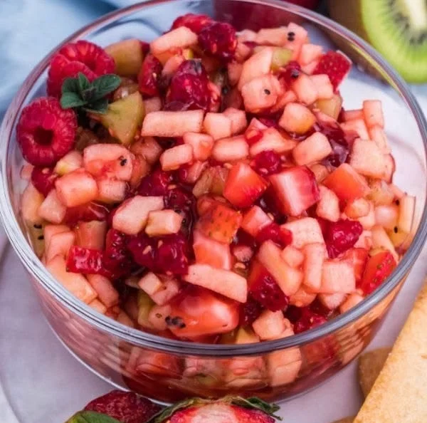 Sweet fruit salad with colorful fruits and cinnamon sugar tortilla chips